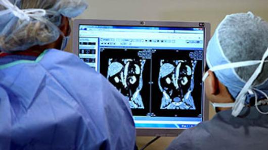 Medical professional studies a patient’s medical images.