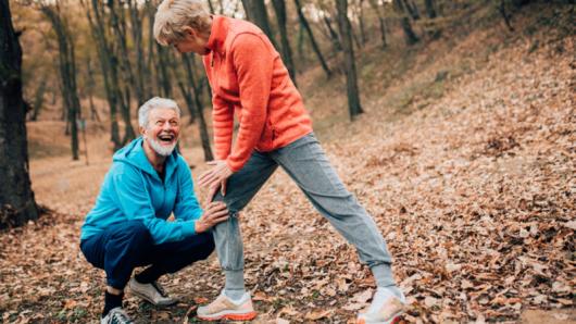 Kneeling man and stretching woman